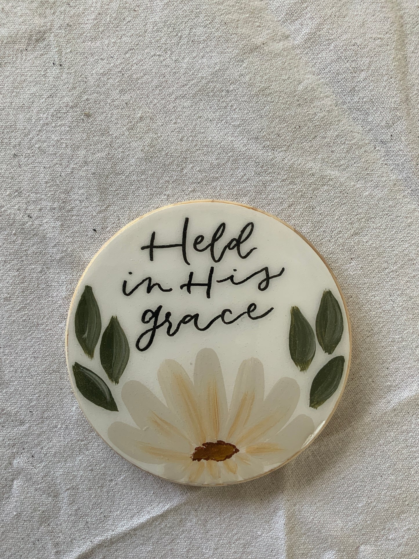 Held in His grace